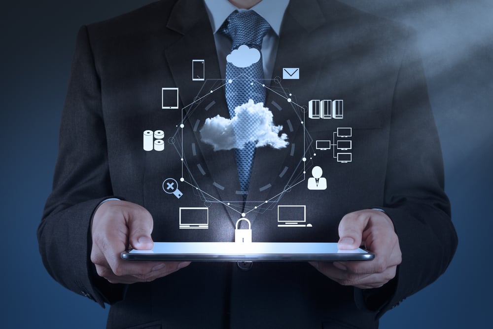 Businessman hand working with a Cloud Computing diagram on the new computer interface as concept Businessman hand working with a Cloud Computing diagram on the new computer interface as concept